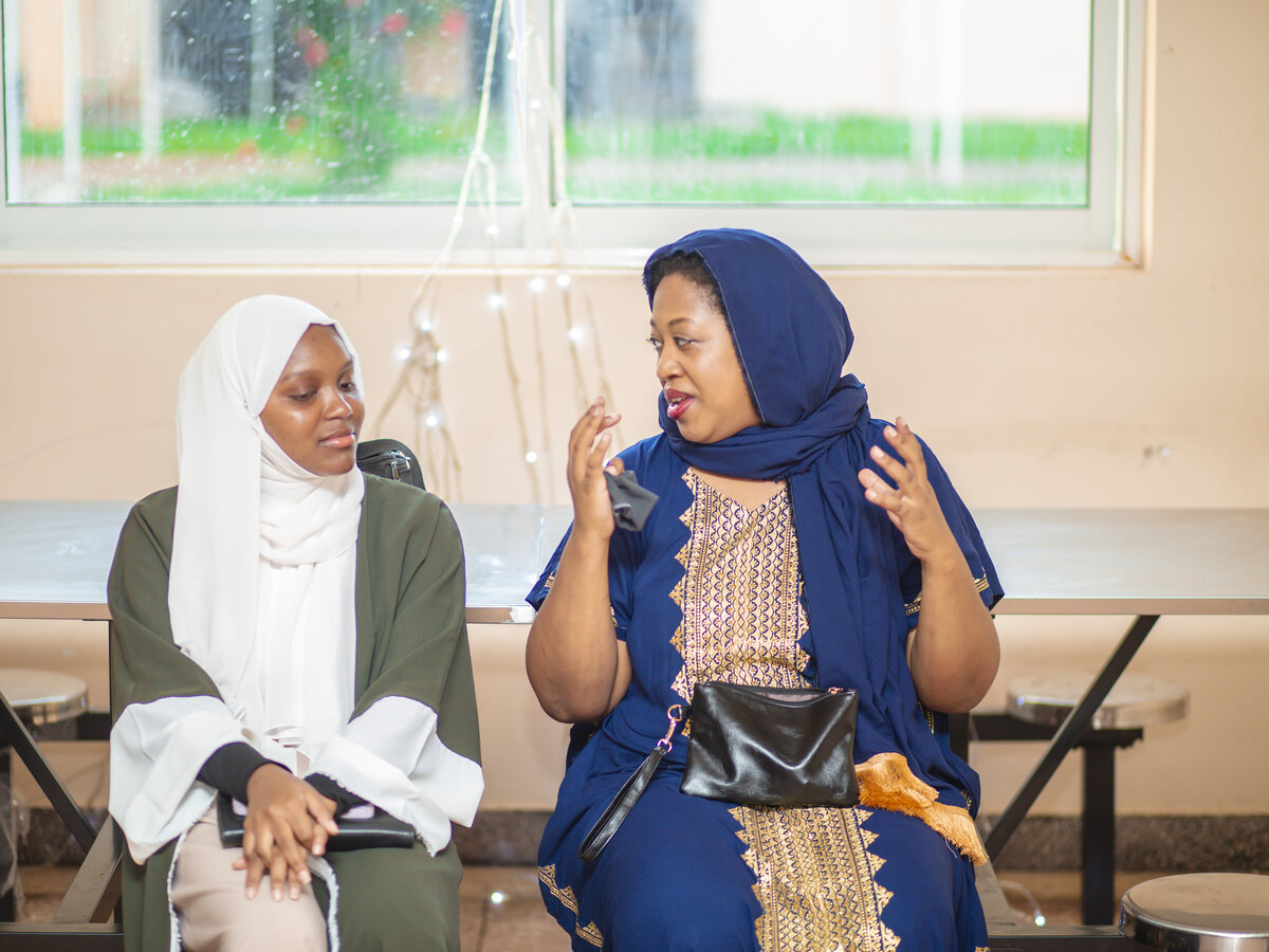 Hope K. McCoy in conversation with a student in Zanzibar, Tanzania