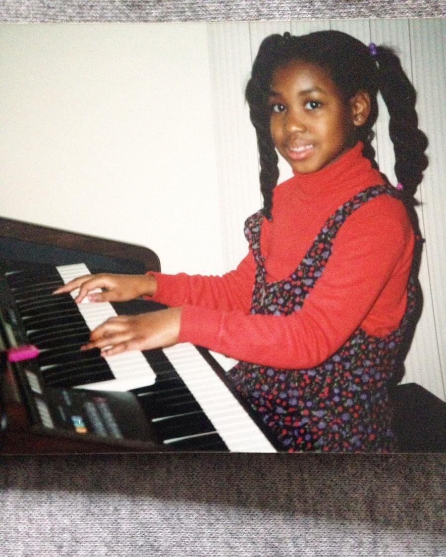 Hope K. McCoy as a child at the piano